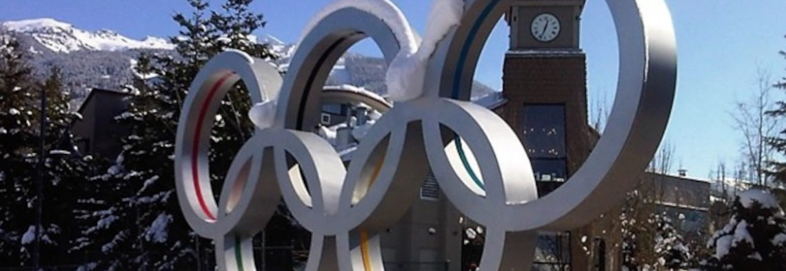 Olympic Games symbol in a snowed landscape